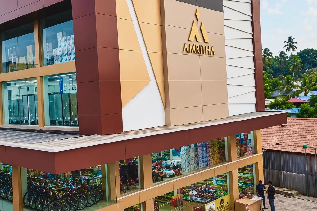 Amritha electronics and appliance showroom in Ottapalam featuring home appliances, electronics, bicycles, and children's ride-on toys.