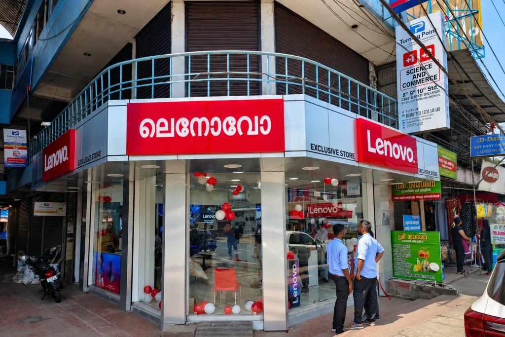 Lenovo Exclusive Store in Ottapalam displaying Lenovo laptops, desktops, gaming PCs, and computer accessories.