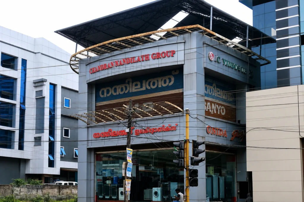 Nandilath G-Mart electronics showroom in Ottapalam offering TVs, home appliances, refrigerators, washing machines, and consumer electronics.
